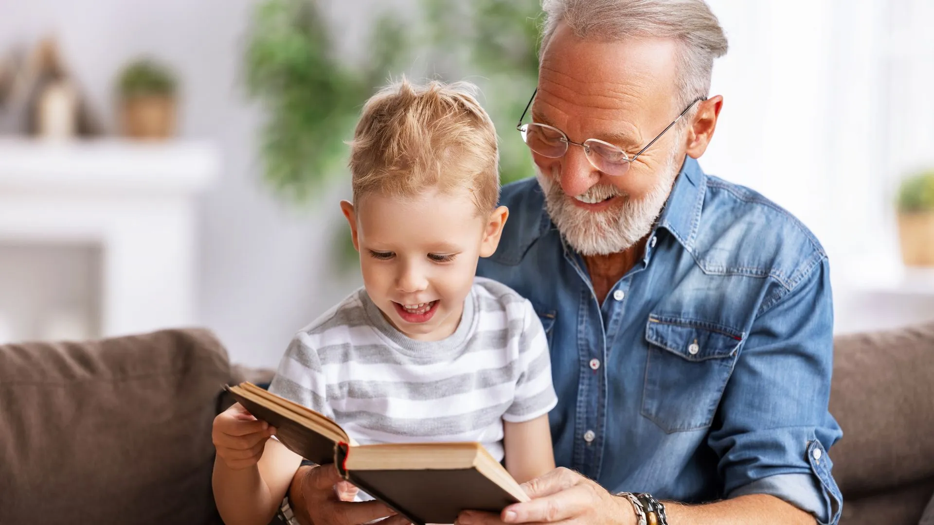 A grandfather reading a story with his grandson